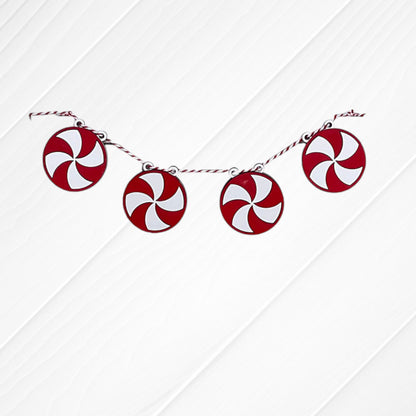 Four Heartland Tiered Tray Garlands – Painted, featuring red and white peppermint candy designs, are displayed on a twine against a white wooden background. Choose from 12 styles.