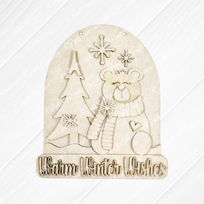 The Polar Bear Door/Wall Hanger by Janet's Craft Corner showcases a bear with a scarf next to a festive pine tree and snowflakes. Reads "Warm Winter Wishes"—the perfect DIY home decor or door hanger craft for the winter season.