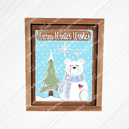 This farmhouse sign by Janet's Craft Corner features a framed 3D winter scene with a pine tree, snowflakes, and a [olar bear against a snowy blue backdrop. Its rustic wooden frame adds warmth to your home decor, inviting the season indoors with its welcoming message.