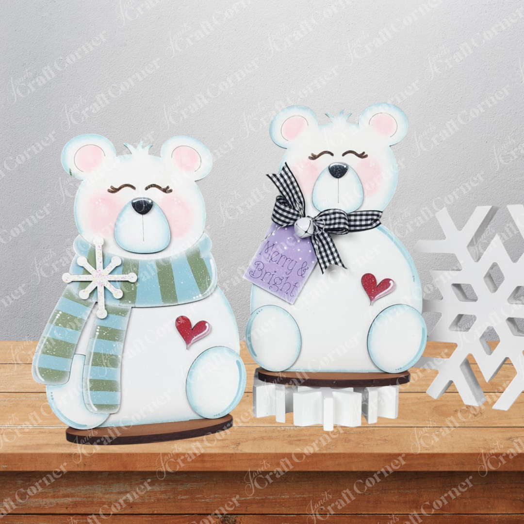 Janet's Craft Corner Polar Bear Shelf Sitters—DIY seasonal home decor craft kit (choice of 2)—includes cute white bear figurines with striped scarves, "Merry & Bright" sign, gingham bow, and snowflake accents for a festive touch.