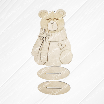 Create charming Polar Bear Shelf Sitters with Janet's Craft Corner DIY kit—features a wooden polar bear in scarf and mittens, holding a snowflake with a heart, and three oval slots. Choose from 2 seasonal designs for unique home decor.