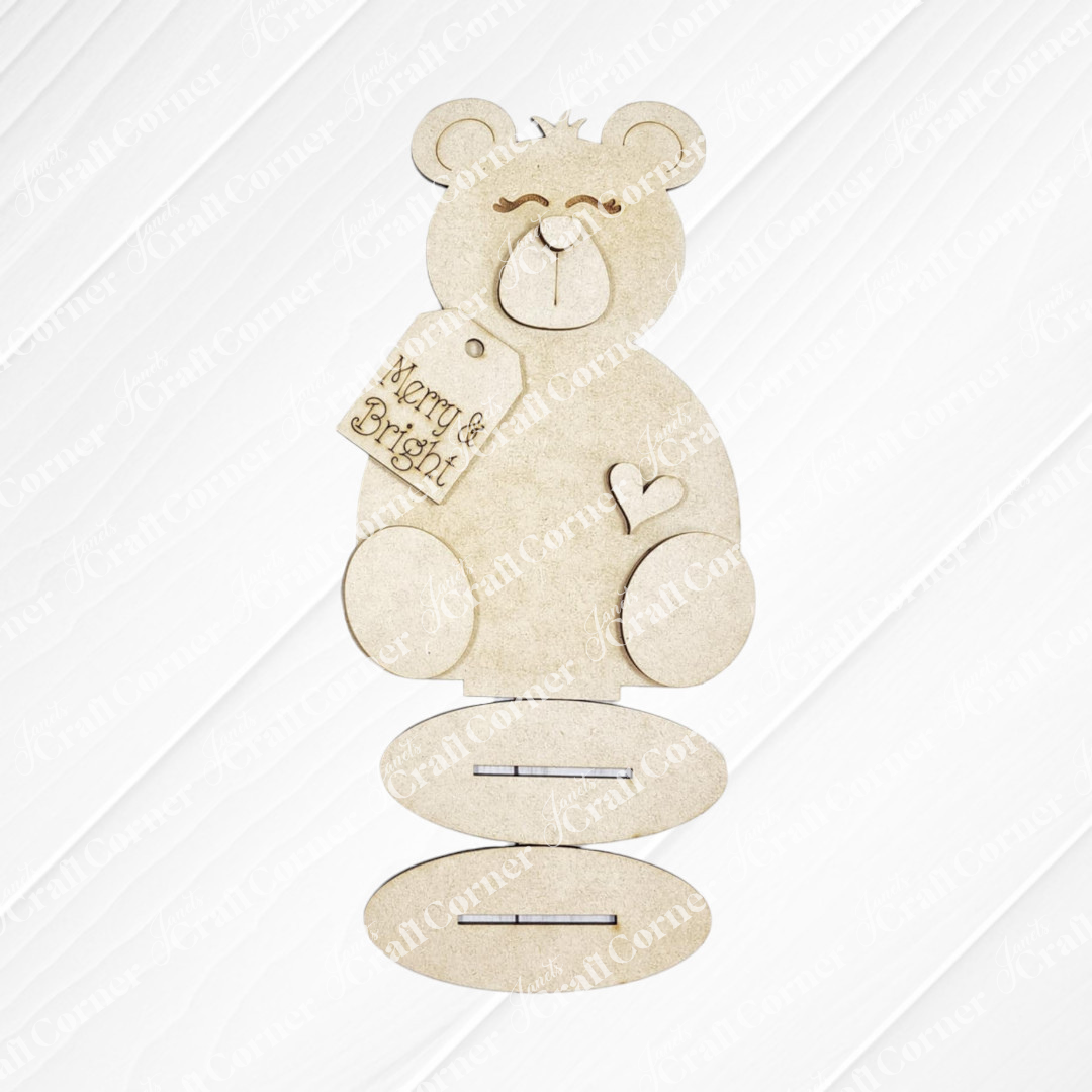 Janet's Craft Corner Polar Bear Shelf Sitters is a DIY seasonal decor kit featuring three oval-shaped pieces with slots to assemble your own festive polar bear, available in two styles. Perfect for holiday decorating!.