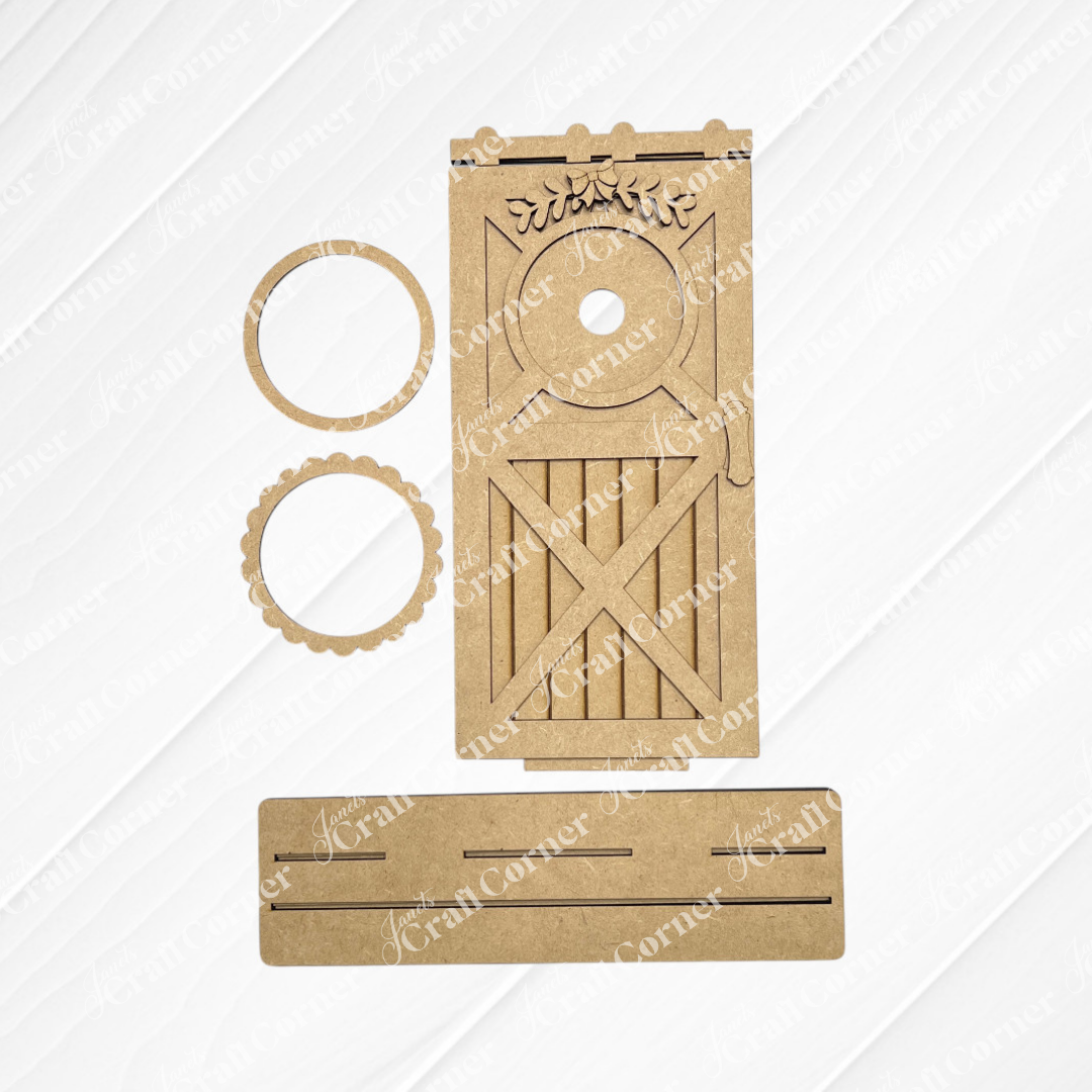 Janet's Craft Corner Farmhouse Porch Interchangeable Base kit includes a barn-style door with round window and leaf detail, two round frames, and a slotted rectangular base—perfect for DIY seasonal wall art and farmhouse accents.