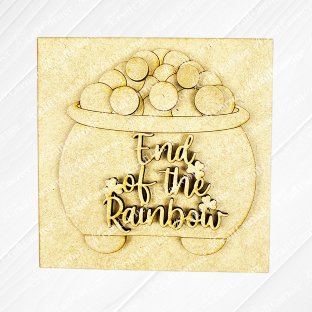 Janet's Craft Corner St Patricks Squares features a laser-cut wooden pot of coins with "End of the Rainbow" in cursive. This light wood piece is perfect tiered tray decor and pairs well with other cut-outs or Swappable Squares.