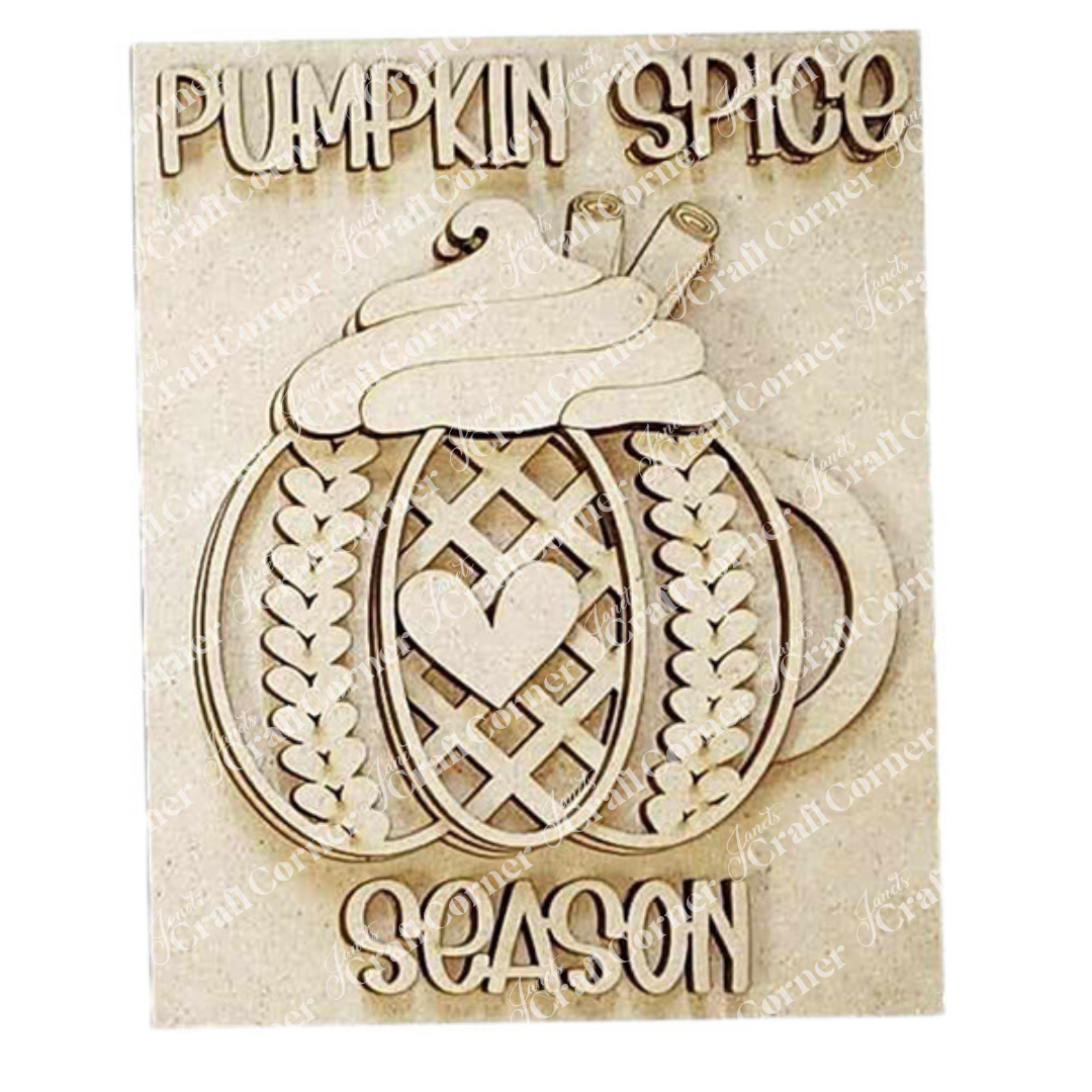 The Pumpkin Spice Season Interchangeable Sign from Janet's Craft Corner displays a carved pumpkin pie decorated with whipped cream and cinnamon sticks. Featuring the phrase "Pumpkin Spice Season" around the design, it includes a heart on the pie. Ideal for DIY Craft Kit enthusiasts, this sign is designed to capture the spirit of autumn.