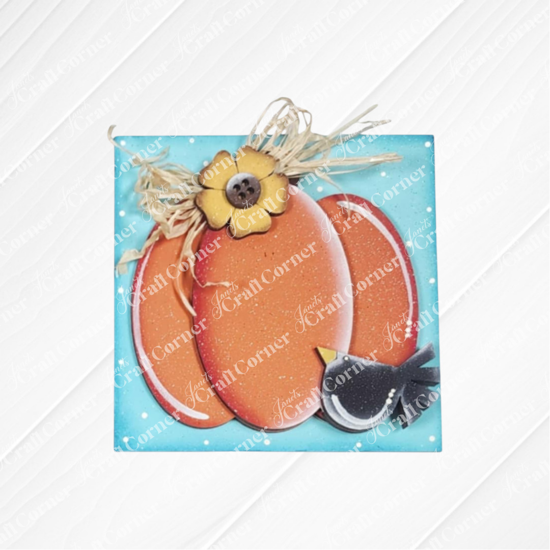 Janet's Craft Corner Fall Scarecrow Squares: A painted wood decor featuring an orange pumpkin with a yellow flower, raffia accents, blue background, and a black-and-white bird—perfect for your seasonal home decor.