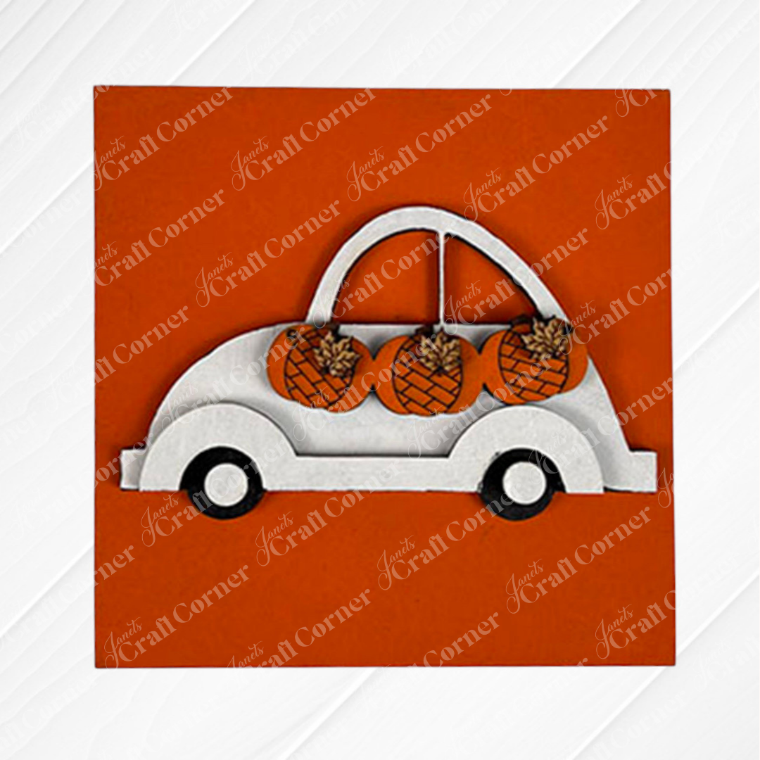 Pumpkin Spice Squares by Janet's Craft Corner features a white wooden car cutout carrying three orange pumpkins with brown stems and leaf details, all set on a solid orange background—perfect for tiered tray decor.