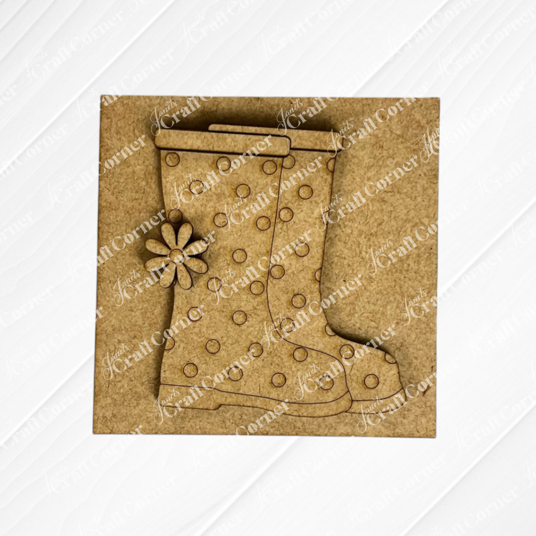 The Hello Spring Squares by Janet's Craft Corner features two polka-dotted rain boots, one overlapping with a small flower on the front. Ideal for tiered tray decor or Swappable Squares displays on a plain brown background.