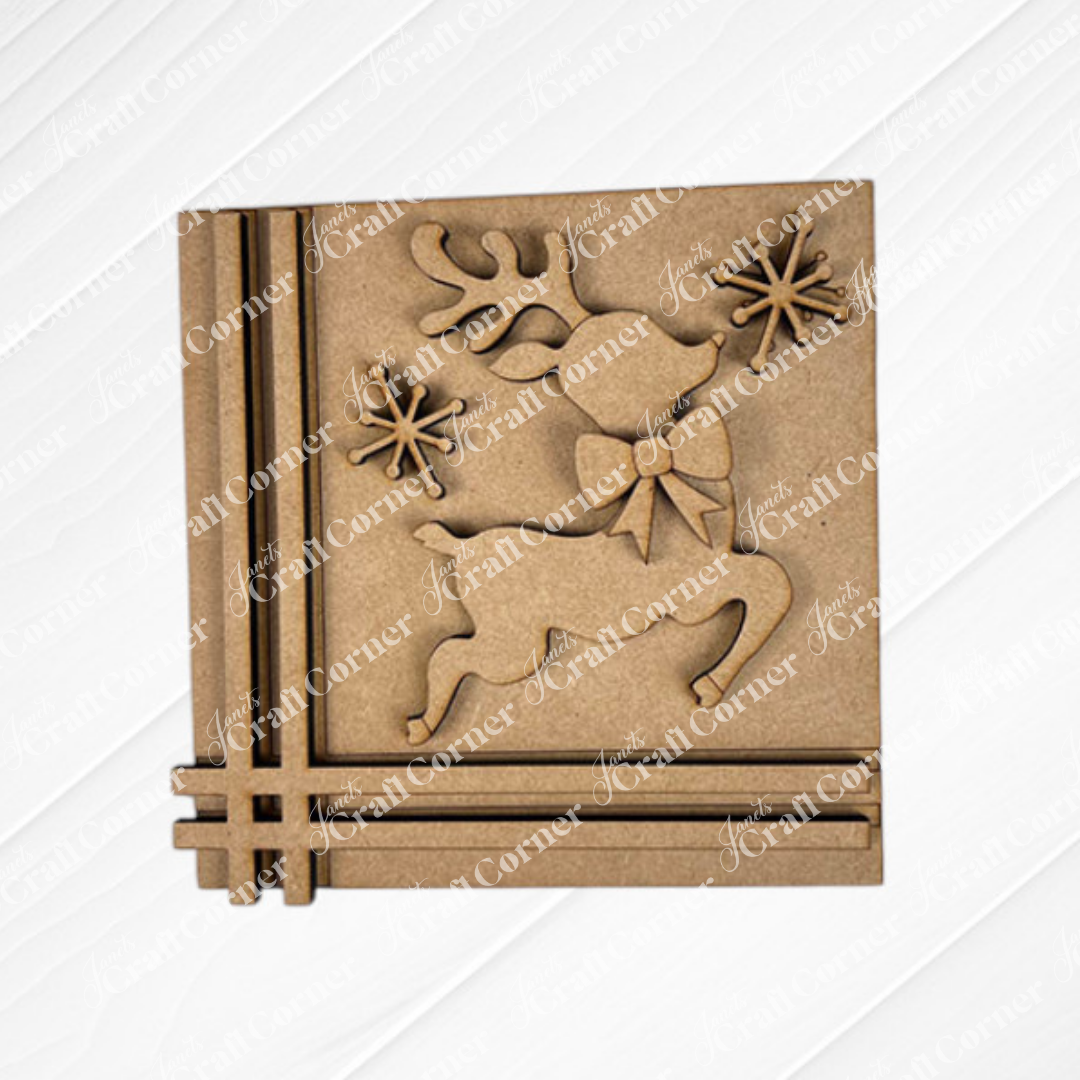 The Merry Christmas Squares by Janet's Craft Corner is a square wooden decoration with a reindeer and bow, two snowflakes, and three lines in the bottom left, ideal for festive DIY seasonal home decor.
