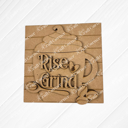 The Coffee Swappable Squares DIY craft kit by Janet's Craft Corner features a wooden coffee cup cutout with whipped cream, beans, spoon, and “Rise & Grind” text—perfect for coffee lovers or unique seasonal home decor.