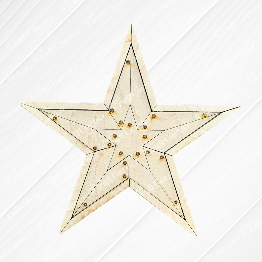 The Rustic Star Shelf Leaner by Janet's Craft Corner features unfinished wood with engraved black lines and brass studs at each point, ideal for displaying on a shelf against a light textured backdrop.