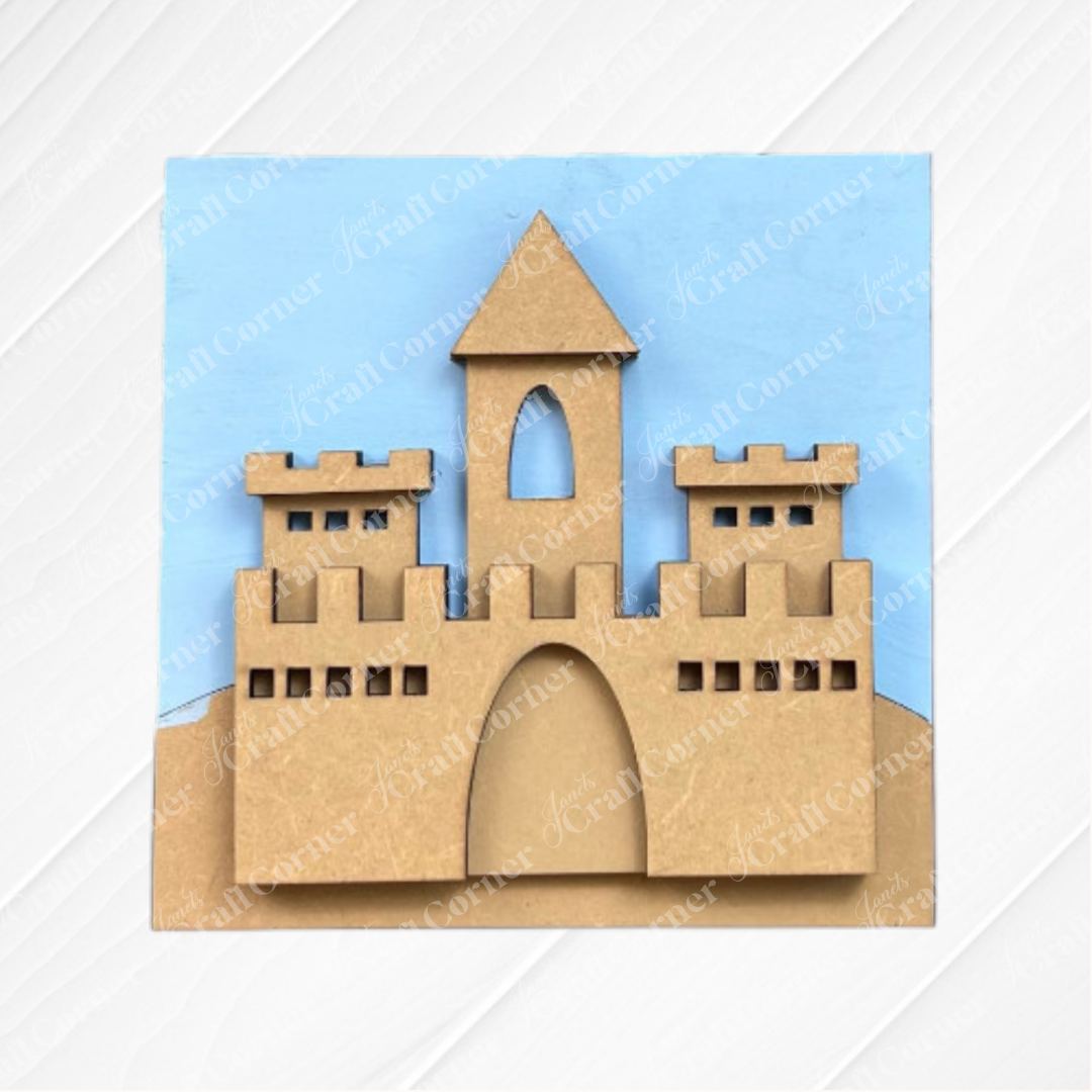 Add a whimsical touch to your coffee bar or tiered tray with Janet's Craft Corner's Summer Beach Squares DIY craft kit—a cardboard castle cutout set on a blue background and sandy hill, perfect for seasonal home decor.