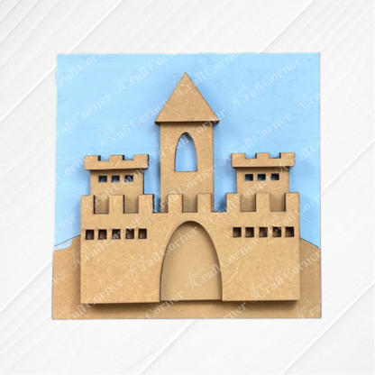 Add a whimsical touch to your coffee bar or tiered tray with Janet's Craft Corner's Summer Beach Squares DIY craft kit—a cardboard castle cutout set on a blue background and sandy hill, perfect for seasonal home decor.