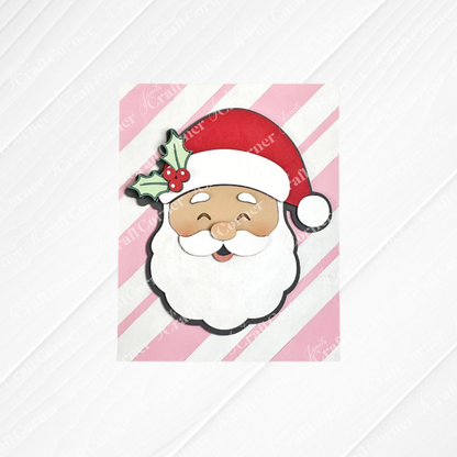 This Merry Midcentury Modern Switchable Farmhouse Sign by Janet's Craft Corner features a cartoon Santa face with a red hat, white beard, and holly on a pink and white striped background—perfect DIY decor for the holidays!.