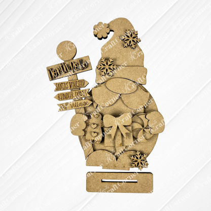 Explore the delightful Santa Gnome Shelf Sitter by Janet's Craft Corner, a wooden cutout adorned with a festive Santa hat. With detailed engravings of snowflakes, candy, and North Pole signs, it’s perfect for holiday decor. This charming piece includes a slot at the bottom and is an ideal DIY craft kit to ignite your creativity!