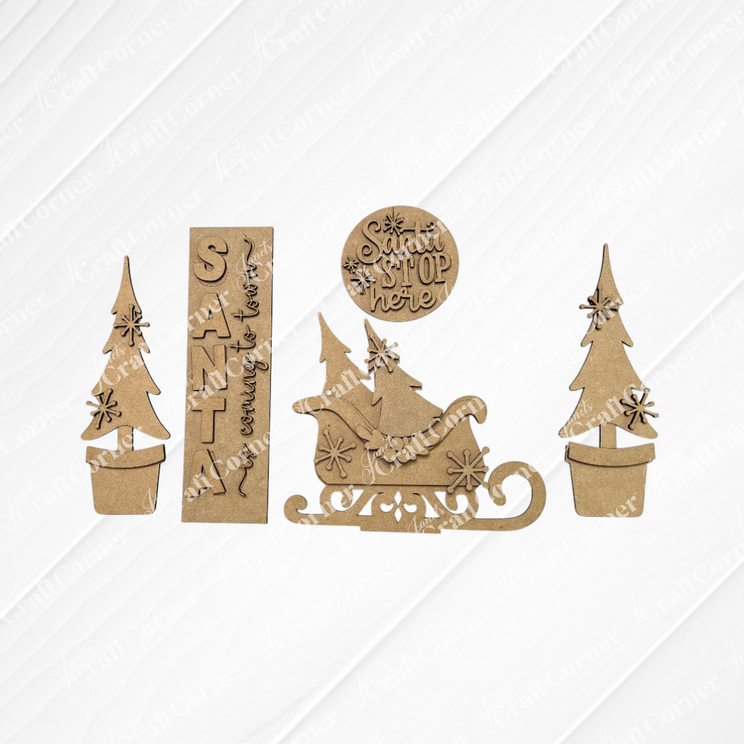The Santa Interchangeable Porch Set by Janet's Craft Corner includes 5 laser-cut cardboard signs—two potted Christmas trees, two “Santa stop here” signs, and Santa in a sleigh—perfect for your DIY seasonal home decor craft kit.