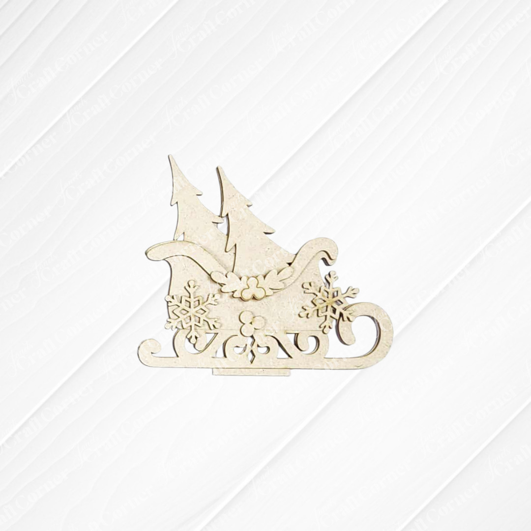 The North Pole Decor Set by Janet's Craft Corner features a beige wooden sleigh ornament with pine trees and snowflakes, perfect for holiday home decor, shown on a white textured background.