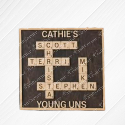 The Scrabble Board Sign from Janet’s Craft Corner displays names like Scott, Terri, Christa, Stephen, and Mike crossword-style on a dark background—perfect as a custom teacher gift.