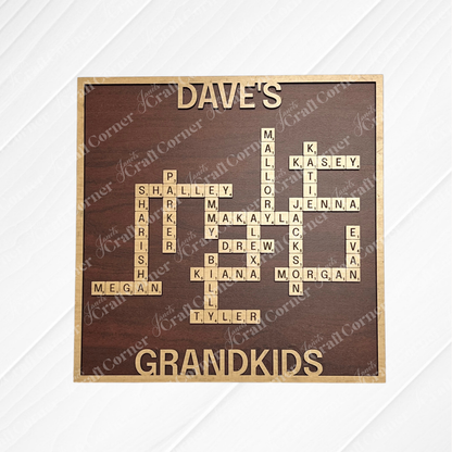 The Scrabble Board Sign by Janet's Craft Corner features engraved wood tiles that spell names in a crossword pattern under "DAVE'S GRANDKIDS," with a dark brown background and gold lettering—a unique personalized display.