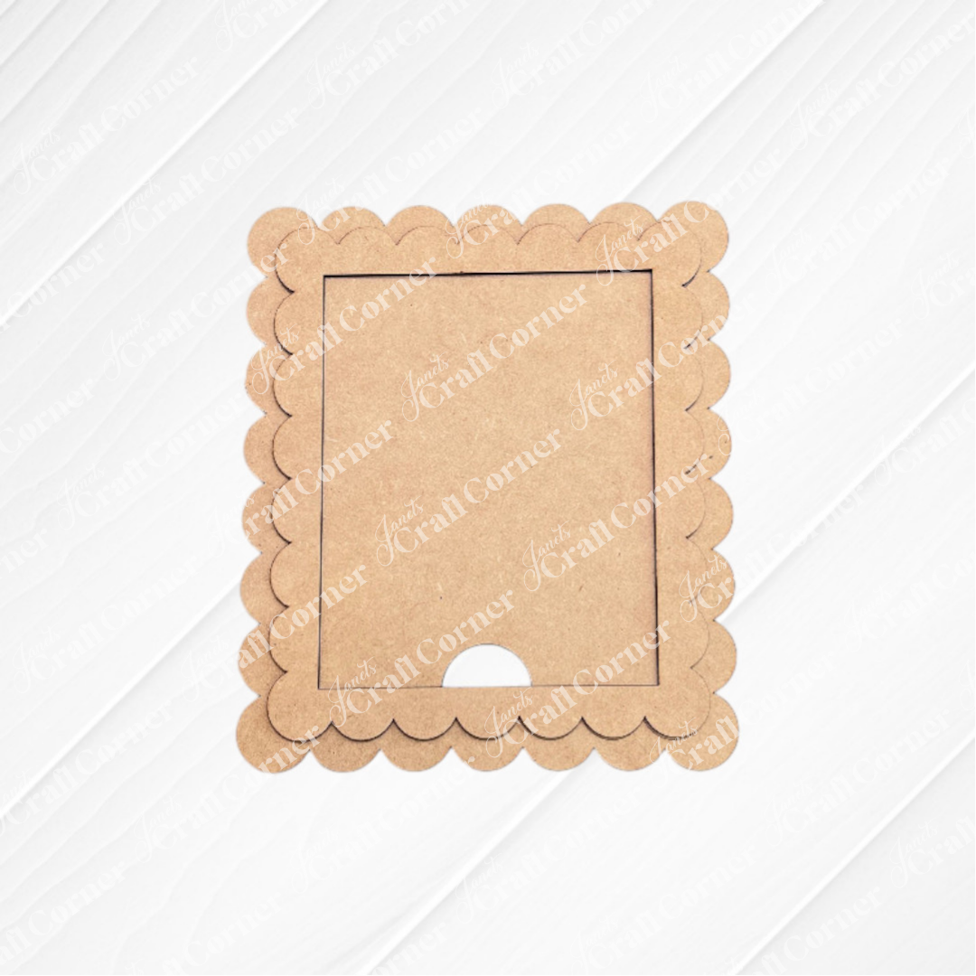 The Single Scallop Trim Farmhouse Frame from Janet's Craft Corner features a square brown cardboard design with scalloped edges and a rectangular opening, perfect for interchangeable display on any white textured background.