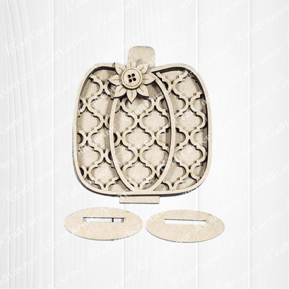 Janet's Craft Corner Fall Harvest Mini Shelf Sitters DIY kit features a wooden pumpkin with a lattice design, flower button accent, and oval stands—ideal for autumn home decor or crafting projects. Set of 1.