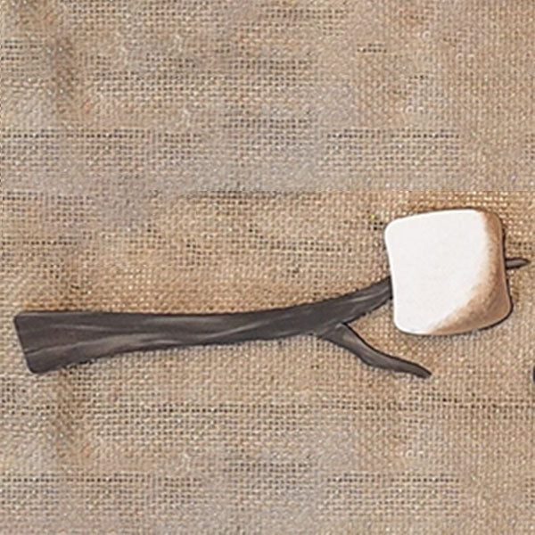 On a textured burlap surface rests a feature from Janet's Craft Corner: the S'mores - Tiered Tray Kit, which includes a stone tool with a rounded, light-colored head and a dark, intricately carved wooden handle. The handle’s natural branch-like design is perfect for adding rustic charm to your home décor.