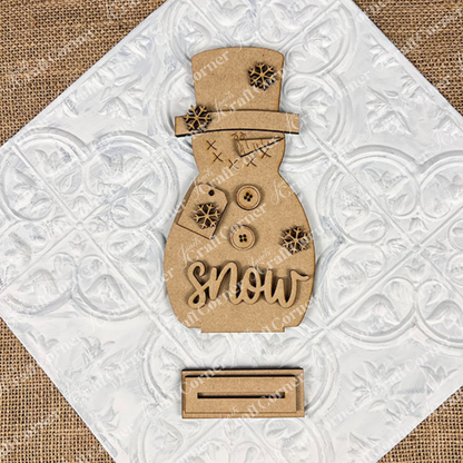 Janet's Craft Corner Snowman Shelf Sitters on a white tile make a perfect festive home decoration or charming winter decor accent.