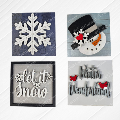 Snow Squares from Janet's Craft Corner: four swappable signs for seasonal decor—white snowflake on blue, snowman face with hat and carrot nose, "let it snow" in script, and "Winter Wonderland" with two red cardinals.