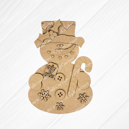 The Candy Cane Snowman Door Hanger from Janet's Craft Corner is a delightful wooden decoration featuring button and snowflake cutouts. Holding a candy cane, it wears a holly-adorned top hat and displays a "Merry & Bright" tag, perfect for holiday decor lovers.