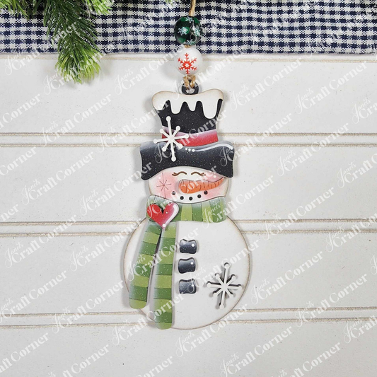 Janet's Craft Corner Snowman Ornaments DIY holiday craft kit (Set of 1) features a snowman with a green-striped scarf, black hat, heart accent, and snowflakes—perfect festive décor for your home.