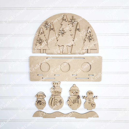 Create a charming winter scene with Janet's Craft Corner Snowman Tealight Shelf Sitter DIY kit, featuring laser-cut wooden shapes—a half-circle with trees, snowflakes, five snowmen, and a base—perfect for seasonal home decor.