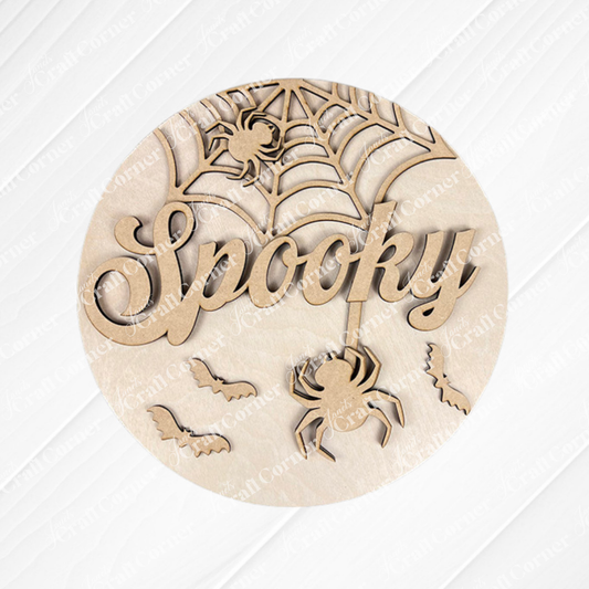 Add a festive touch to your home with the “Spooky Halloween Wall Hanger” from Janet’s Craft Corner. This DIY seasonal home decor craft kit features a wooden round sign intricately carved with the word “Spooky,” a spider dangling from a web, another spider perched on the web, and three flying bats—all in a Halloween theme.