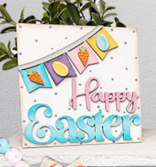 Janet’s Craft Corner Easter Bunny Decor Set - Painted: Add charming farmhouse style to your space with this decorative sign featuring “Happy Easter” in pastel colors and a festive banner adorned with carrots and eggs, all set against a white background with purple dots and green leaves—perfect as a DIY home decor kit or cheerful holiday accent.