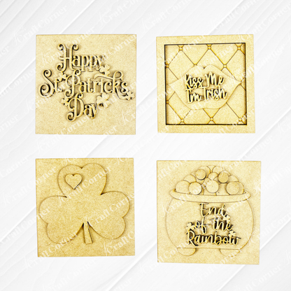 Janet's Craft Corner St Patricks Squares includes four wood cut-outs: "Happy St. Patrick’s Day" with clovers, "Kiss Me I’m Irish," a shamrock heart, and a pot of gold—ideal Swappable Squares for tiered tray decor.