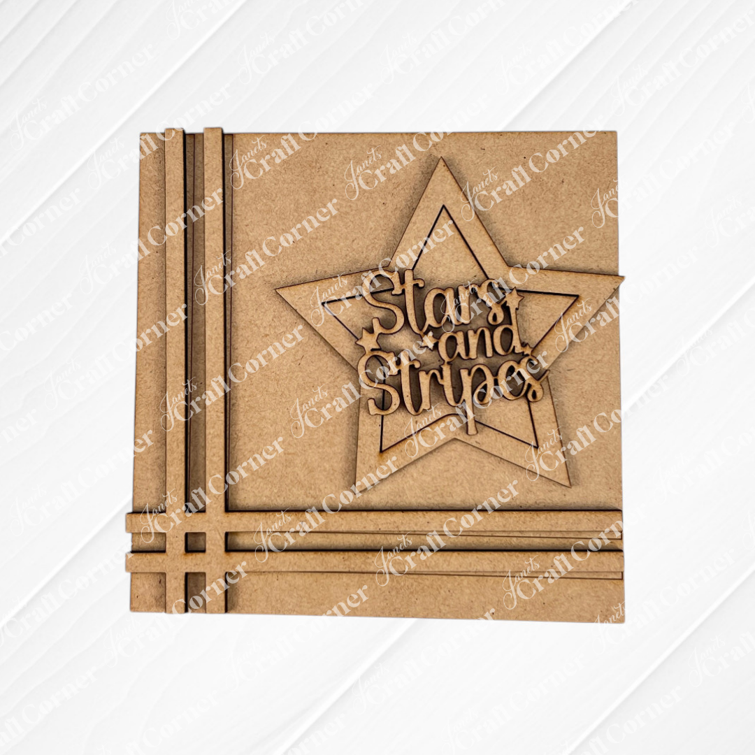 The Patriotic Squares DIY craft kit from Janet's Craft Corner features a square brown wooden plaque with a star outline and “Stars and Stripes” cutout letters—perfect for Independence Day décor.