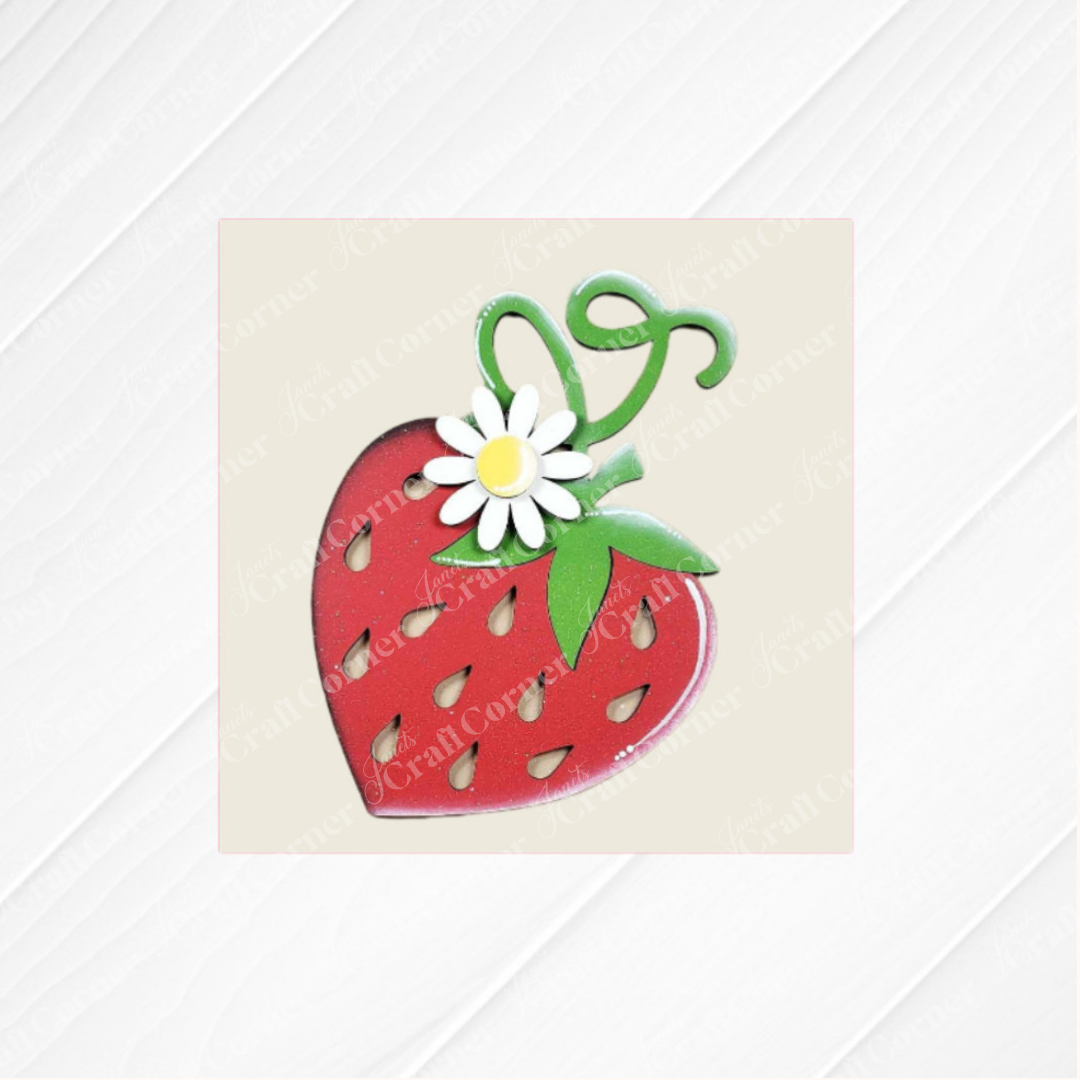 Janet's Craft Corner's Strawberry Swappable Squares DIY kit features a red strawberry with green leaves, a white daisy, and curly stems on a pale, diagonally patterned background—perfect for seasonal tiered tray decor.