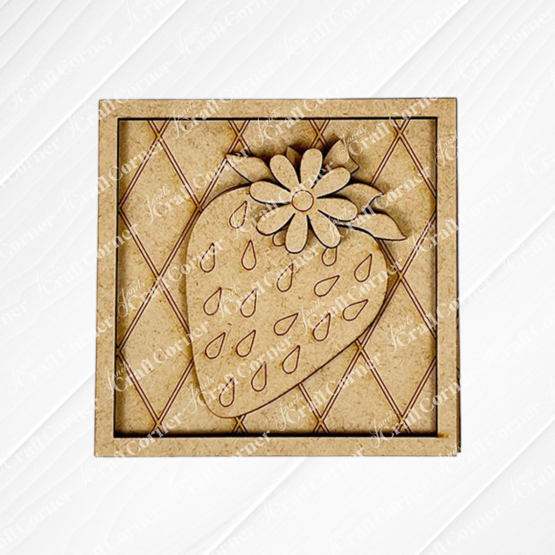 The Strawberry Swappable Squares DIY craft kit from Janet's Craft Corner features a wooden square coaster with a carved strawberry and flower, teardrop seeds, and a diamond-patterned light wood background—perfect for seasonal tiered trays.