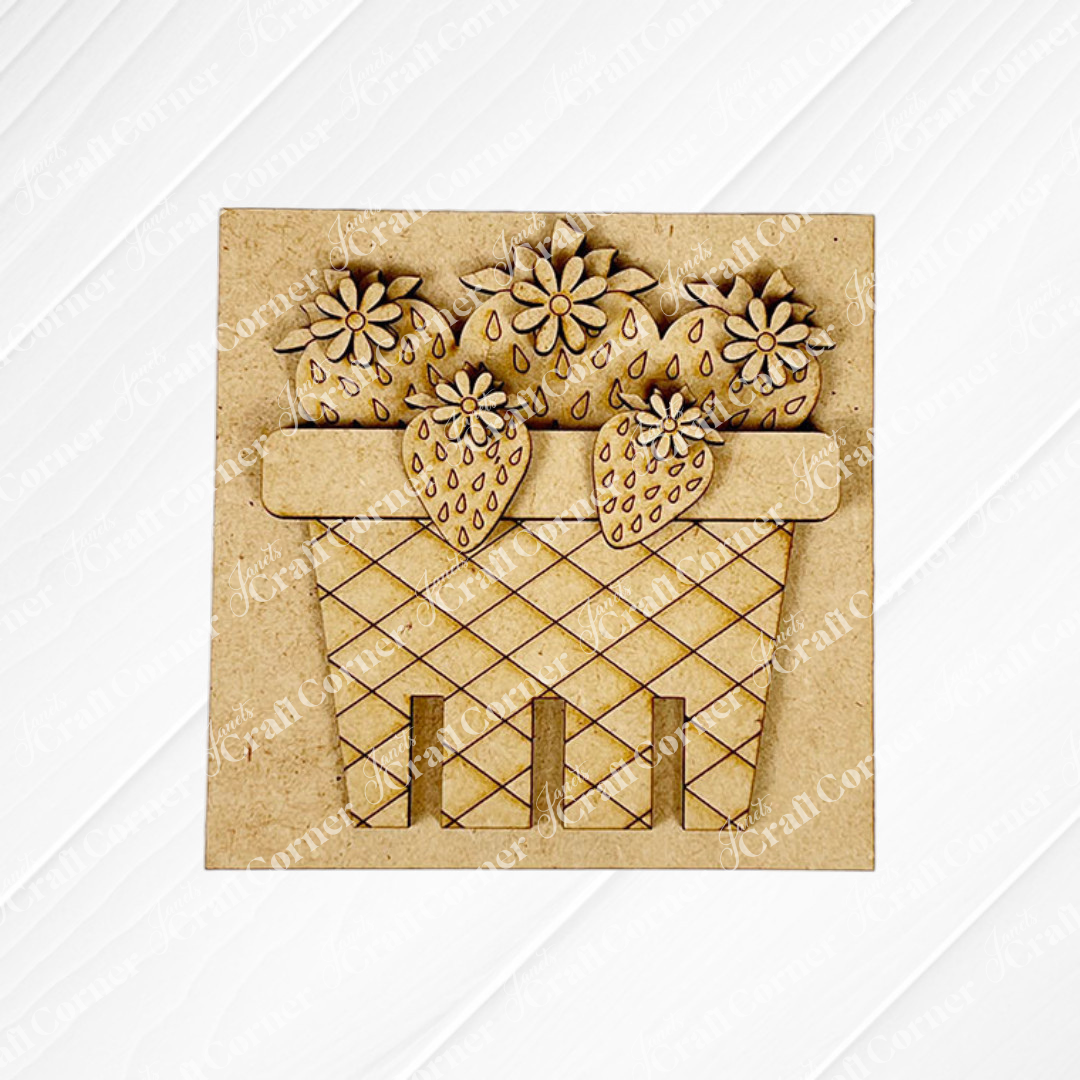 Janet's Craft Corner’s Strawberry Swappable Squares is a DIY seasonal home decor craft kit featuring laser-cut wooden strawberries and flowers in a crisscross basket—perfect tiered tray decor, displayed on a light textured background.
