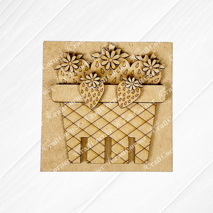 Janet's Craft Corner’s Strawberry Swappable Squares is a DIY seasonal home decor craft kit featuring laser-cut wooden strawberries and flowers in a crisscross basket—perfect tiered tray decor, displayed on a light textured background.