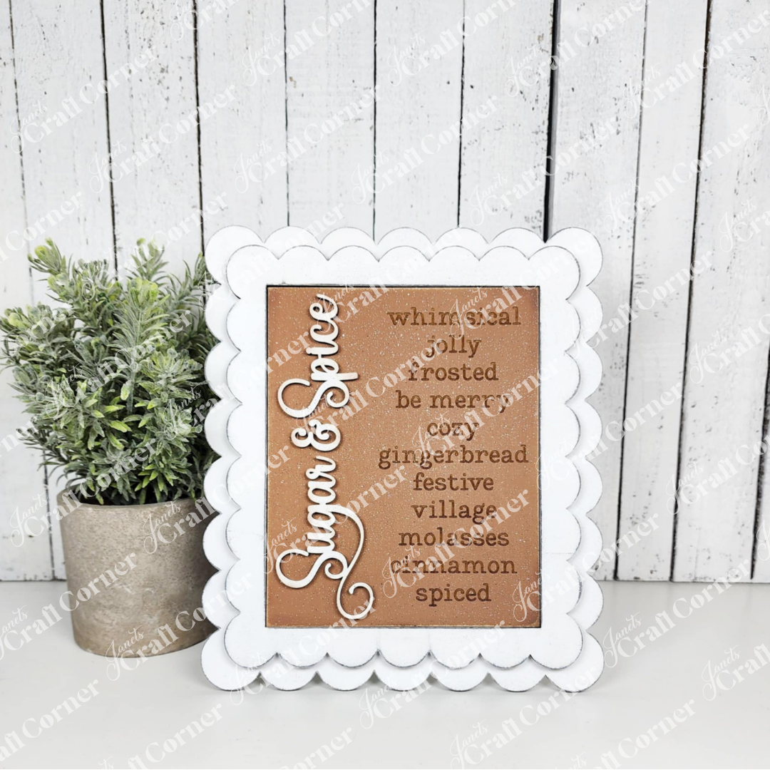 Decorative sign with text in a white frame on a wooden background