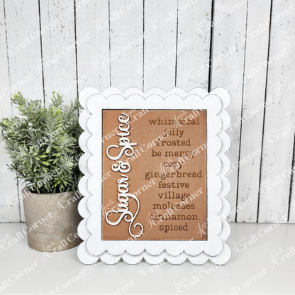 Decorative sign with text in a white frame on a wooden background