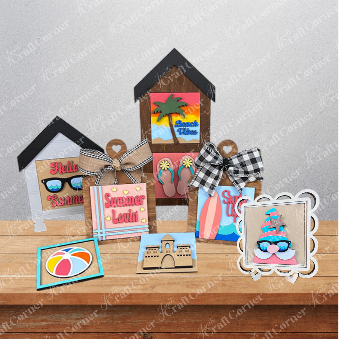 The Summer Lovin Swappable Squares DIY craft kit from Janet's Craft Corner features wooden cut-outs like beach huts, sunglasses, flip-flops, a sandcastle, and a beach ball—perfect for summer-themed tiered tray decor.