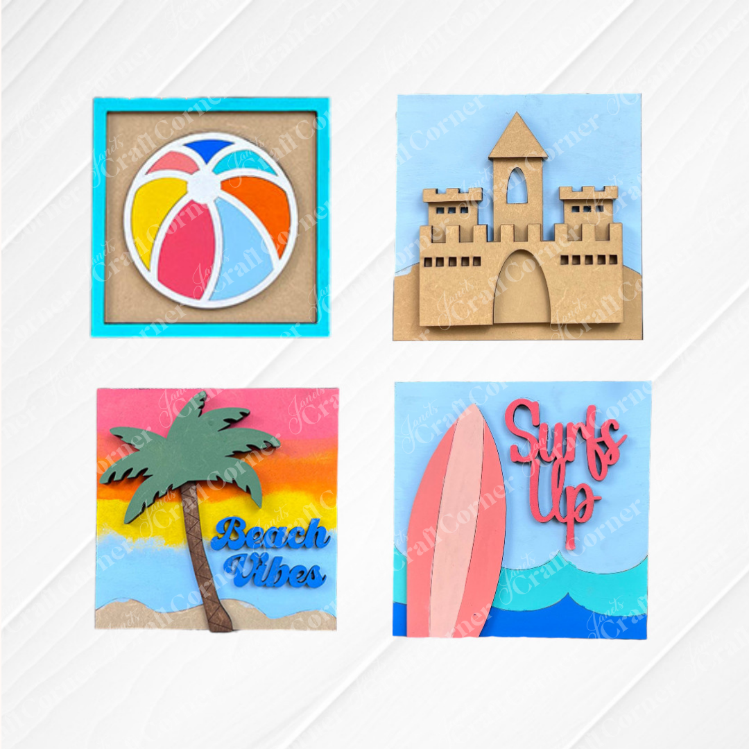 Janet's Craft Corner’s Summer Beach Squares DIY kit features four beachy designs—beach ball, sandcastle, palm tree with "Beach Vibes," and surfboards with "Surf's Up"—perfect for small space decor or tiered tray signs.