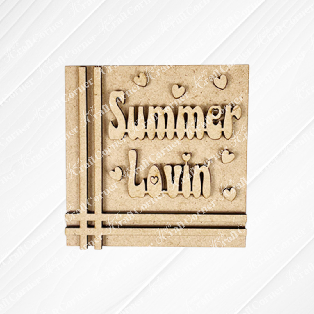 The Summer Lovin Swappable Squares DIY craft kit from Janet’s Craft Corner includes a square wooden plaque engraved with “Summer Lovin’” and heart accents—a great addition to your seasonal tiered tray or wood cut-out collection.