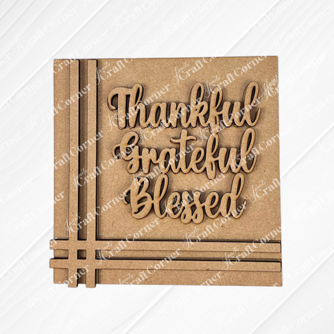 The Harvest Blessings Thanksgiving Squares by Janet's Craft Corner features “Thankful, Grateful, Blessed” in cursive wood cut-outs—ideal tiered tray decor or a charming addition to your Swappable Squares collection.