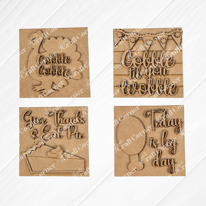 Janet's Craft Corner Thanksgiving Feast Squares: four wooden plaques for tiered tray decor—turkey with “Gobble Gobble,” banner with “Gobble til you wobble,” pie with “Give thanks & eat pie,” and balloon with “Today is big day.”.
