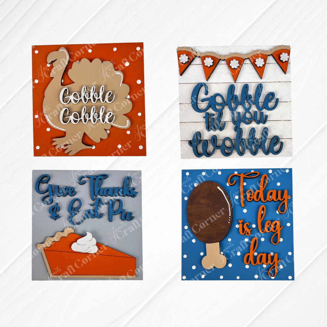 Janet's Craft Corner Thanksgiving Feast Squares feature four wood cut-outs for tiered tray decor: a turkey ("Gobble Gobble"), bunting ("Gobble til you wobble"), pie slice ("Give Thanks & Eat Pie"), and drumstick ("Today is leg day").