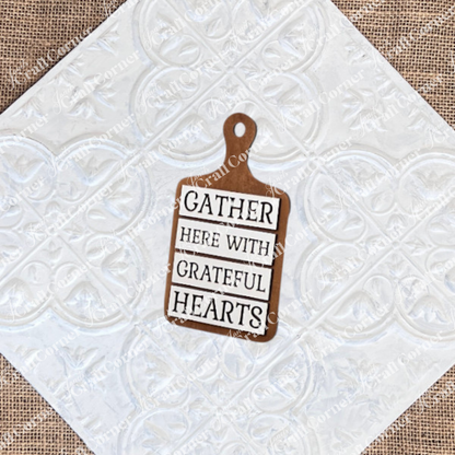 The Thankful Mini Shelf Sitters from Janet’s Craft Corner is a DIY seasonal home decor craft kit featuring "GATHER HERE WITH GRATEFUL HEARTS" in black and white—perfect for your thankful decor set.