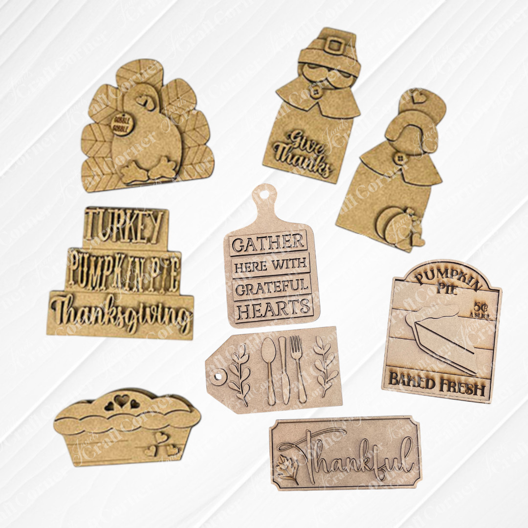 Janet's Craft Corner offers the Thanksgiving Mini Shelf Sitters DIY craft kits ideal for Thanksgiving tiered trays. It includes your choice of 8 unpainted wooden pieces: a turkey, pilgrim couple a word stack with words like "Turkey" and "Pumpkin Pie", breadboard with "Gather Here With Grateful Hearts" saying, a pumpkin pie baked fresh sign, a silverware tag, a pumpkin pie and a "Thanksful" sign for festive home décor.