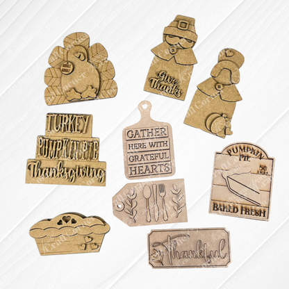 Janet's Craft Corner offers the Thanksgiving Mini Shelf Sitters DIY craft kits ideal for Thanksgiving tiered trays. It includes your choice of 8 unpainted wooden pieces: a turkey, pilgrim couple a word stack with words like "Turkey" and "Pumpkin Pie", breadboard with "Gather Here With Grateful Hearts" saying, a pumpkin pie baked fresh sign, a silverware tag, a pumpkin pie and a "Thanksful" sign for festive home décor.